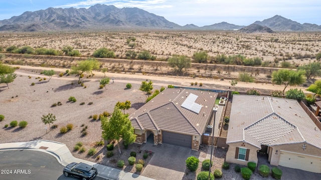 birds eye view of property with a mountain view