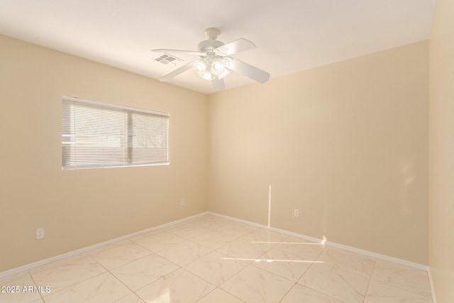 spare room featuring ceiling fan