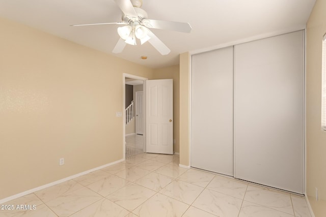 unfurnished bedroom with a closet and ceiling fan