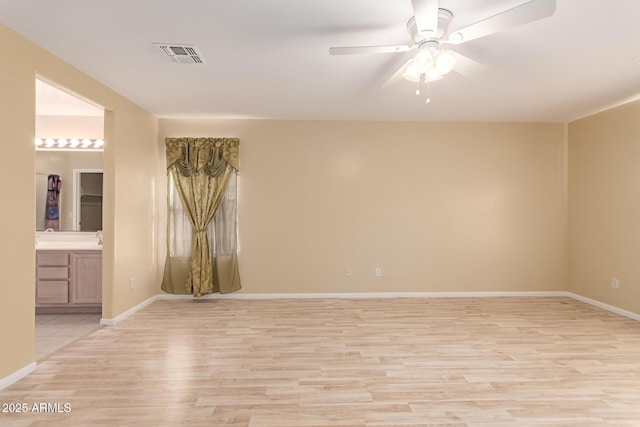 unfurnished room with light hardwood / wood-style floors and ceiling fan