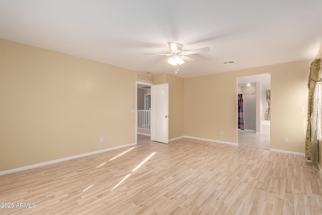 unfurnished room featuring light hardwood / wood-style flooring and ceiling fan