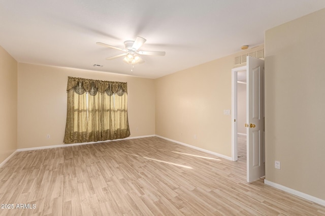 empty room featuring light wood-type flooring and ceiling fan