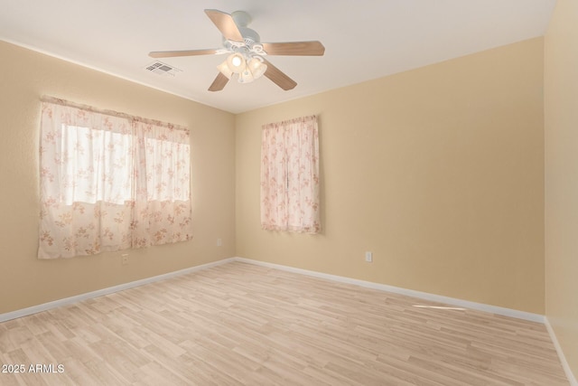 unfurnished room with ceiling fan and light hardwood / wood-style flooring