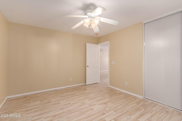 unfurnished room featuring ceiling fan and light hardwood / wood-style floors