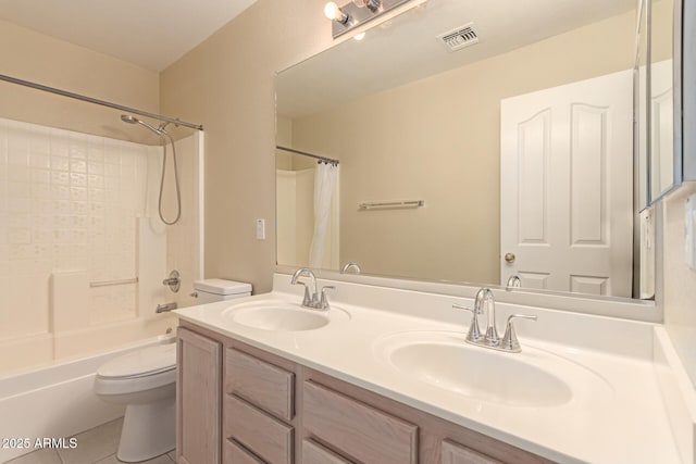 full bathroom with shower / bath combo with shower curtain, tile patterned floors, vanity, and toilet