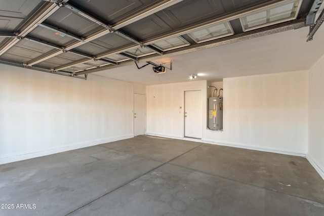 garage with water heater and a garage door opener