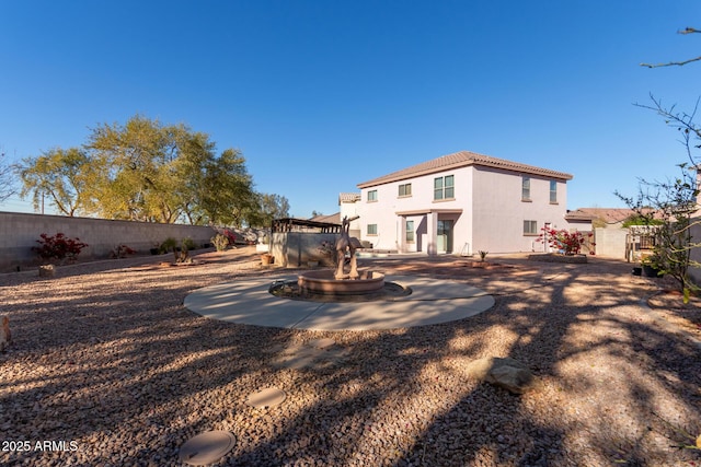 rear view of house with a patio area