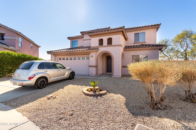 mediterranean / spanish-style house featuring a garage