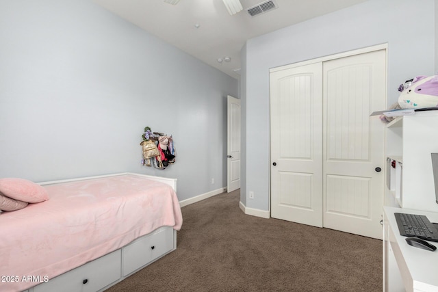12834 W Forest Pleasant Pl, Peoria, AZ 85383 - bedroom featuring dark carpet, a closet, and baseboards
