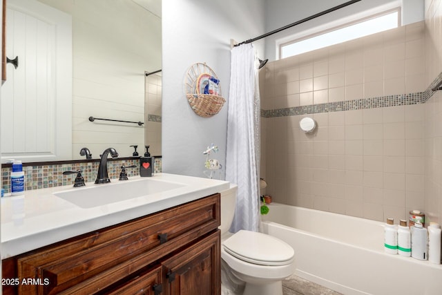 12834 W Forest Pleasant Pl, Peoria, AZ 85383 - full bathroom with vanity, shower / bath combo, toilet, and tasteful backsplash