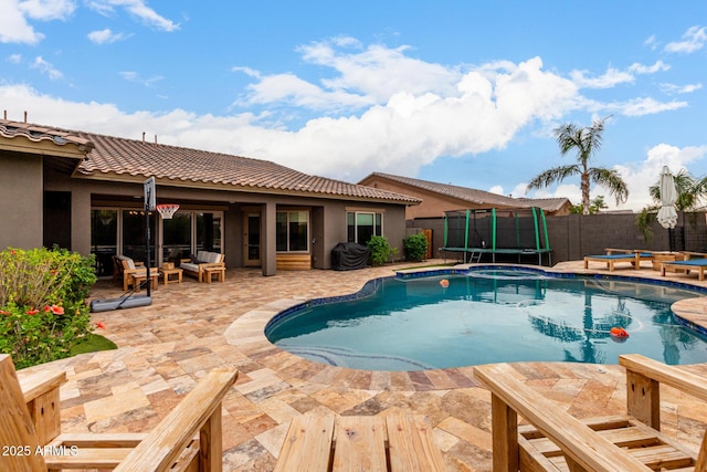 12834 W Forest Pleasant Pl, Peoria, AZ 85383 - view of swimming pool with a trampoline, a fenced backyard, a patio, and an outdoor hangout area