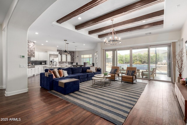 12834 W Forest Pleasant Pl, Peoria, AZ 85383 - living room with a chandelier, beam ceiling, dark wood-style floors, recessed lighting, and baseboards