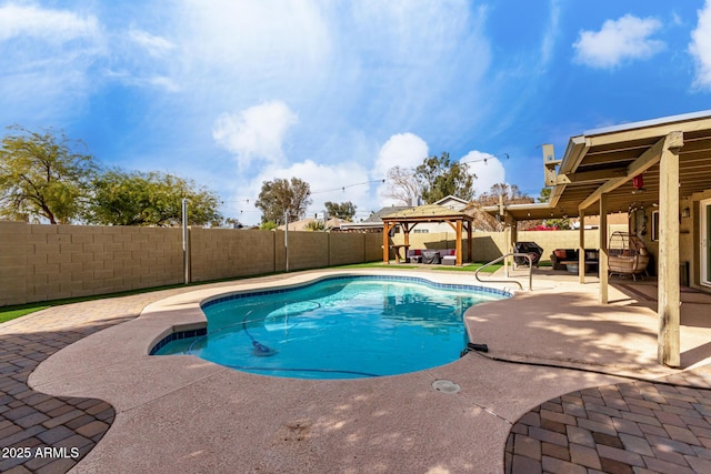 view of swimming pool with a gazebo and a patio