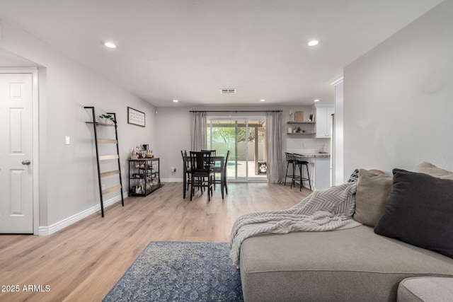 living room with light hardwood / wood-style floors