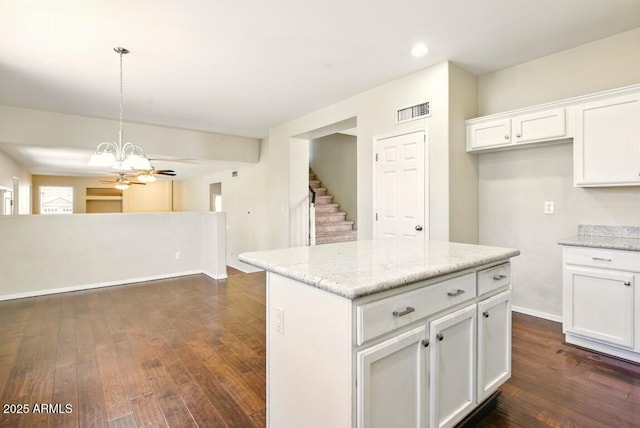 2880 E Nunneley Rd, Gilbert, AZ 85296 - kitchen featuring dark wood-style flooring, white cabinetry, hanging light fixtures, light stone countertops, and recessed lighting