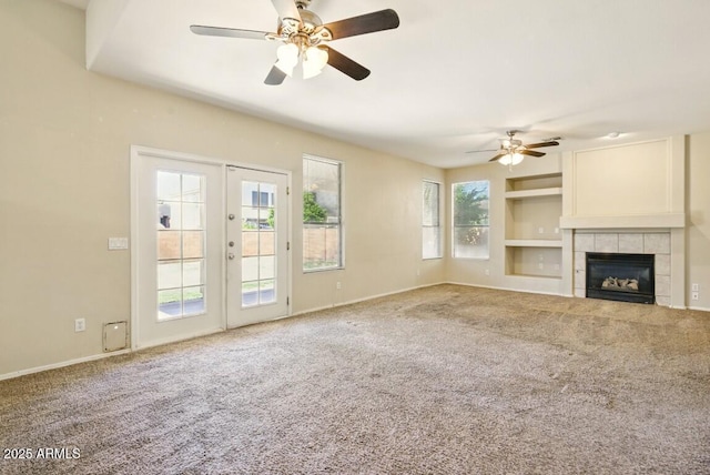 2880 E Nunneley Rd, Gilbert, AZ 85296 - unfurnished living room featuring ceiling fan, carpet floors, a fireplace, built in shelves, and baseboards