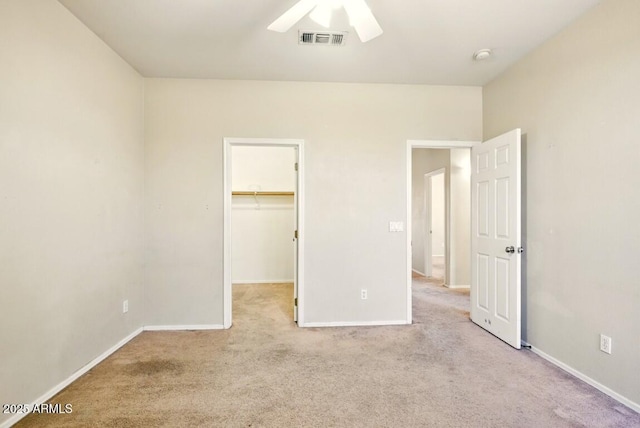 2880 E Nunneley Rd, Gilbert, AZ 85296 - unfurnished bedroom featuring carpet flooring, a walk in closet, and baseboards
