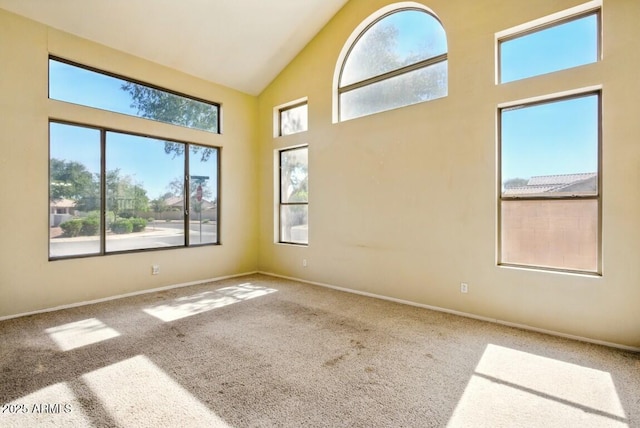 2880 E Nunneley Rd, Gilbert, AZ 85296 - spare room with healthy amount of natural light, carpet, high vaulted ceiling, and baseboards