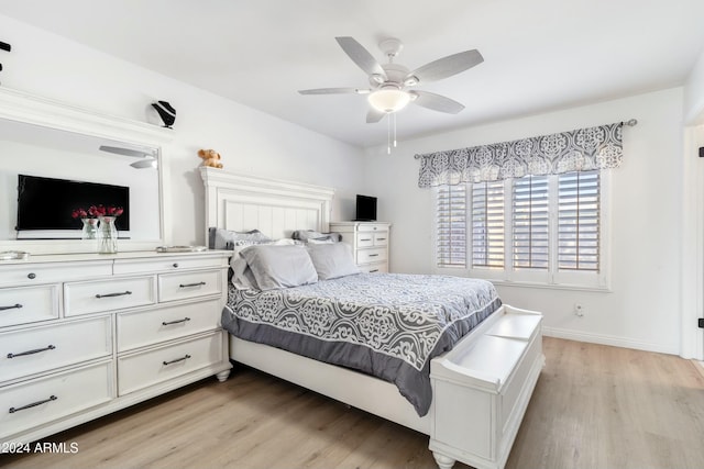 bedroom featuring ceiling fan and light hardwood / wood-style floors