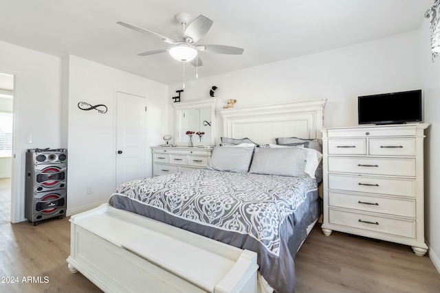 bedroom featuring hardwood / wood-style floors and ceiling fan