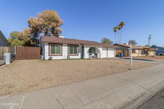 single story home featuring a garage