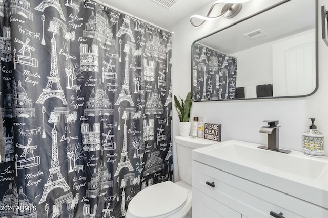 bathroom with vanity and toilet