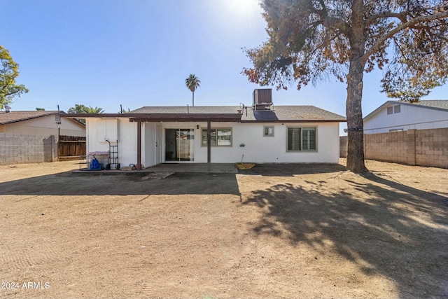 back of property with central AC unit