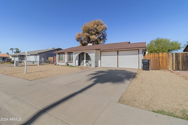 ranch-style home with a garage