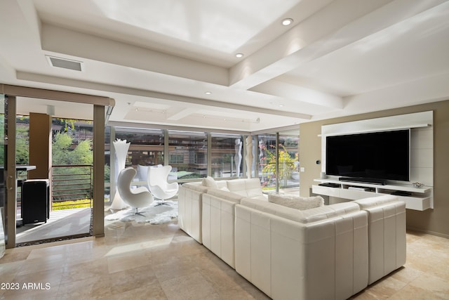 living room featuring plenty of natural light and light tile floors