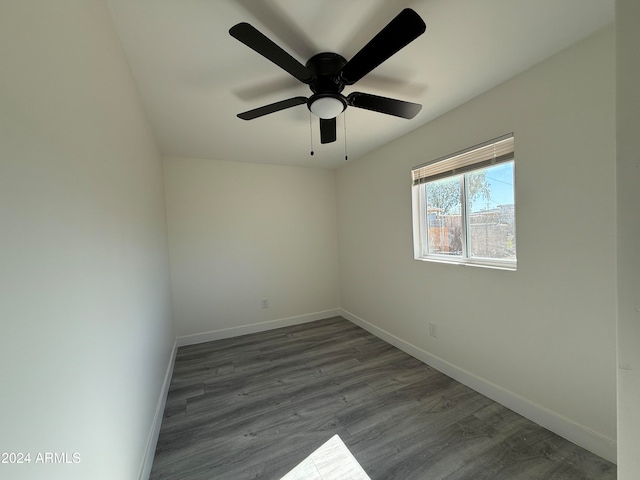 unfurnished room featuring dark hardwood / wood-style floors and ceiling fan