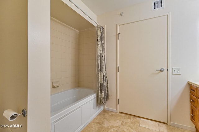 4808 N 24th St Unit 923, Phoenix, AZ 85016 - bathroom featuring vanity, shower / bath combo with shower curtain, and tile patterned floors