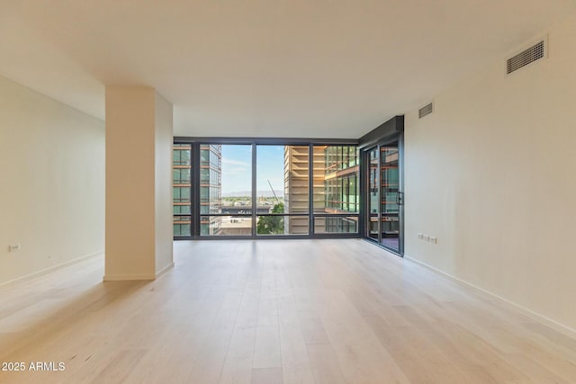 4808 N 24th St Unit 923, Phoenix, AZ 85016 - unfurnished room with floor to ceiling windows and wood finished floors