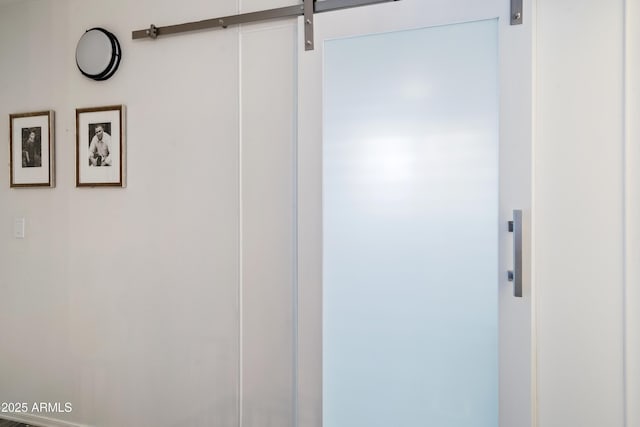 interior space featuring a barn door and elevator