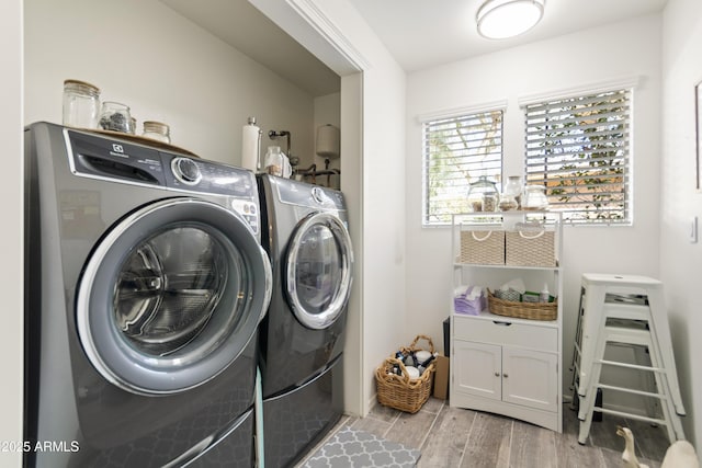 clothes washing area featuring washer and clothes dryer