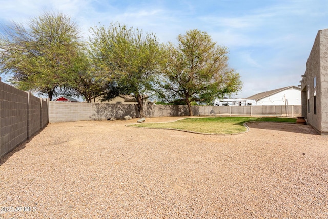 view of yard with a fenced backyard