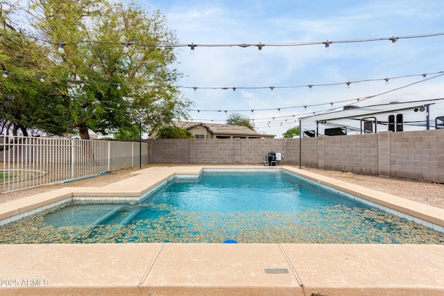 view of swimming pool with a patio, a fenced backyard, and a fenced in pool