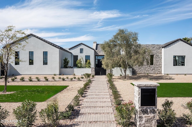 9810 N 57th St, Paradise Valley, AZ 85253 - view of front of property featuring fence, stucco siding, and stone siding