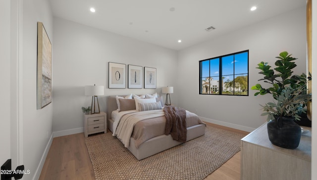 bedroom with light hardwood / wood-style floors