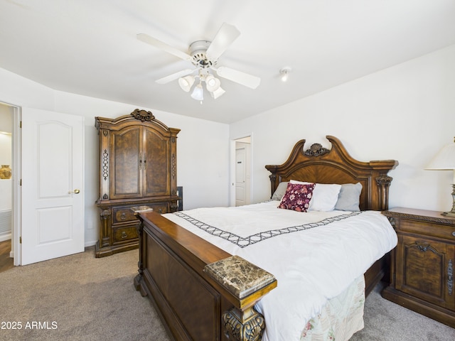 bedroom featuring light colored carpet and ceiling fan