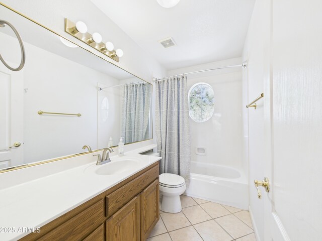 bathroom with toilet, tile patterned flooring, vanity, and shower / bath combination with curtain