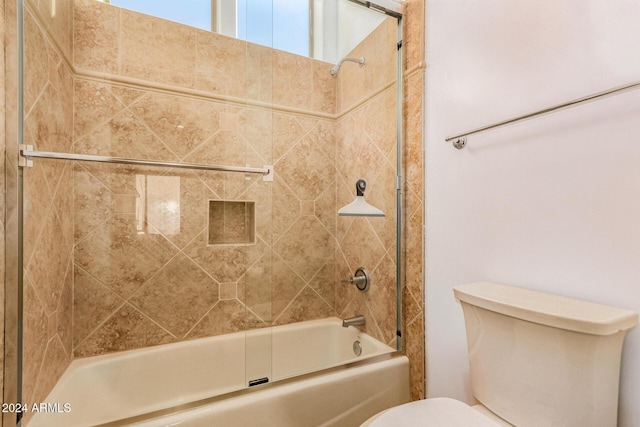 bathroom with toilet and enclosed tub / shower combo