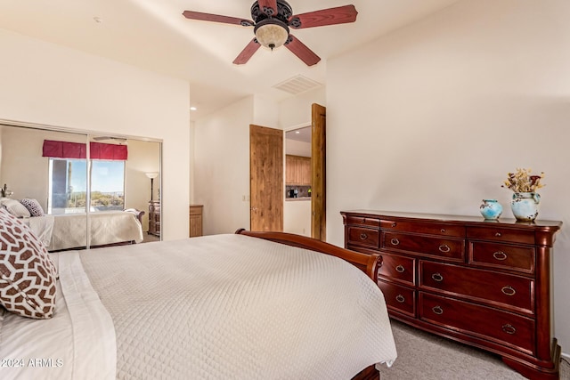 bedroom featuring light carpet, access to exterior, and ceiling fan