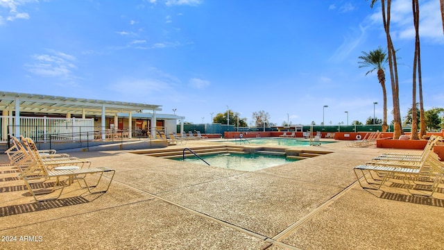 view of swimming pool with a patio