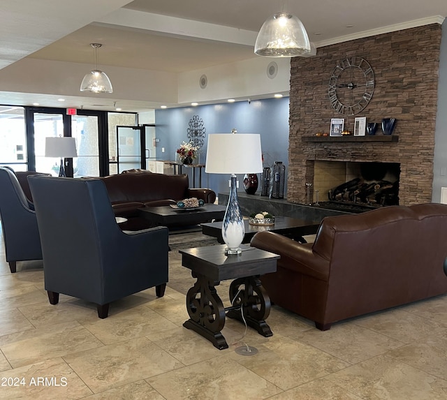 living room featuring a fireplace and ornamental molding