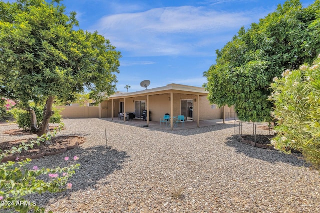 rear view of property with a patio