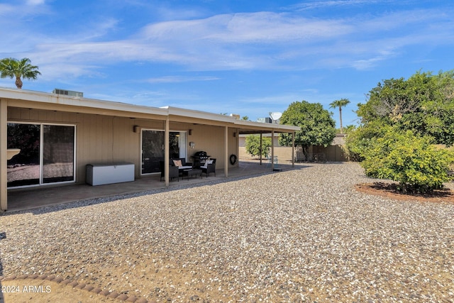 back of property with a patio area