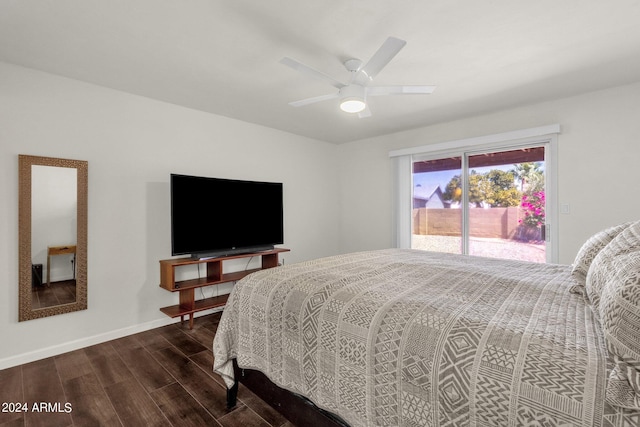 bedroom with dark hardwood / wood-style flooring, access to exterior, and ceiling fan