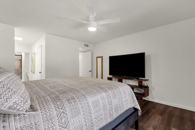 bedroom featuring ceiling fan and dark hardwood / wood-style floors