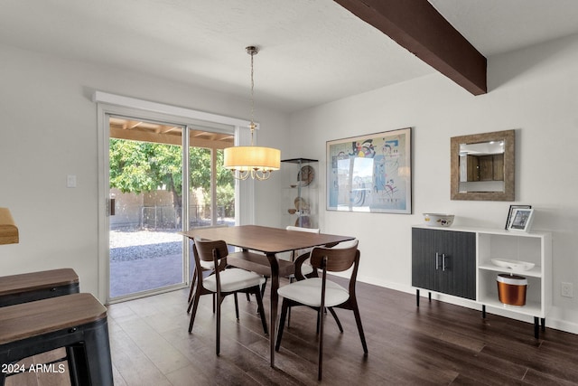 dining room featuring dark wood-type flooring and beam ceiling