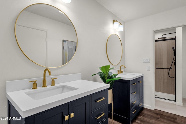 bathroom with hardwood / wood-style floors and vanity